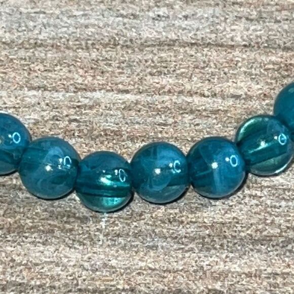 Light Blue Bead Stretch Bracelet with Gold Tone Hamza Hand - Picture 3 of 7